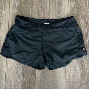 Black Wet dry warm lululemon running shorts with cute waistband. Size 6